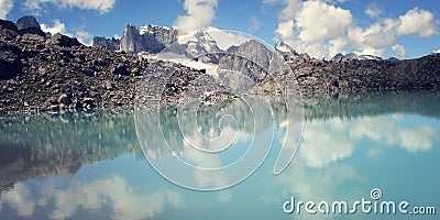 Dolomite Lake at Uzunkol, Caucasus Mountains. Bright blue alpine lake. Stock Photo