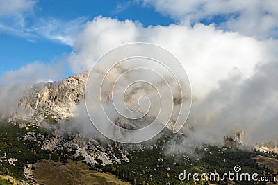 Dolomites covered in Clouds, Cir Mountains above Dantercepies in Val Gardena Stock Photo