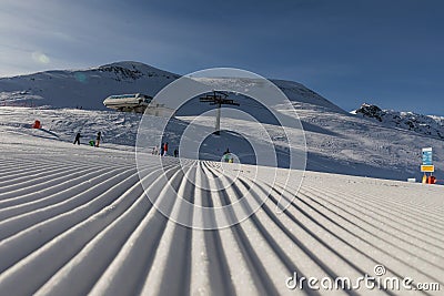 Dolomites, ski area with beautiful slopes. Empty ski slope in winter on a sunny day. Prepare ski slope, Alpe di Lusia, Italy Stock Photo