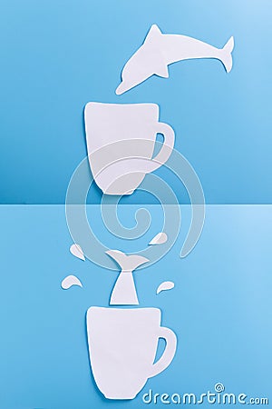 dolphin dive into cup Stock Photo