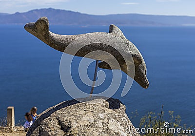 A dolphin sculpture at the Cape Finisterre Lighthouse, in the coast of Galicia, Spain. Editorial Stock Photo