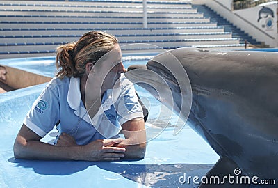 Dolphin and trainer Editorial Stock Photo