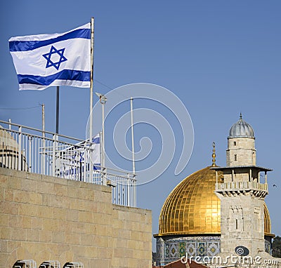 The dome of the rock and a mosque with an israeli flag, jerusalem, israel Stock Photo