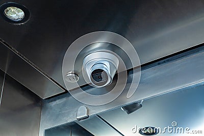 Dome security camera in the public elevator in the business center Stock Photo