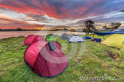 Dome tents camping near lake Stock Photo