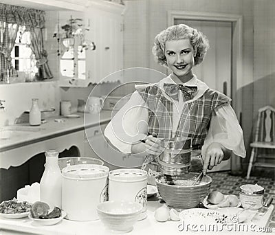 Domestic goddess baking in the kitchen Stock Photo