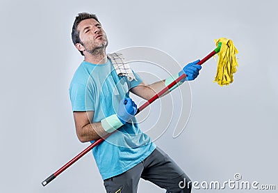 Domestic service man or happy husband cleaning home playing with Stock Photo