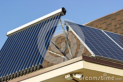 Domestic solar panel on a roof, with clear, cloudless sky Stock Photo