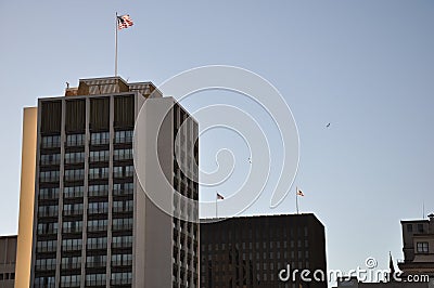 Dominating american skyscraper with american flag Stock Photo