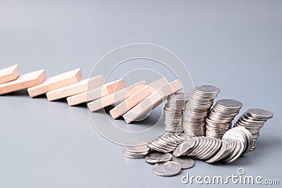 Domino effect impacts finance status Stock Photo