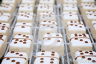 domino themed iced cakes on a baking tray Stock Photo