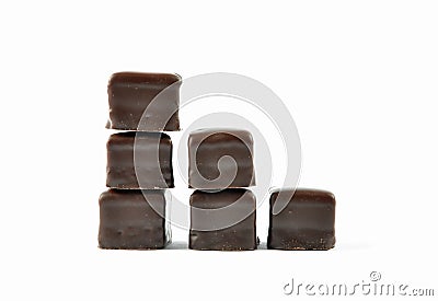 Dominosteine lined up in stacks on white background Stock Photo