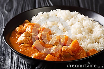 Domoda, a delicious peanut stew, is the national dish of Gambia. The rich and delicious vegetable and meat stew is served over Stock Photo