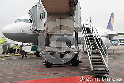 Domodedovo airport, Moscow - November 11th, 2010: Airbus A320-200 of Lufthansa with Jetbridge Editorial Stock Photo