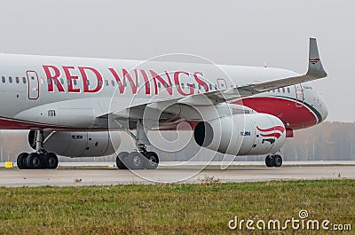 Domodedovo airport, Moscow - October 25th, 2015: Tupolev Tu-204-100B of Red Wings Airlines Editorial Stock Photo