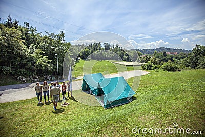 DOMZALE, SLOVENIA - Jul 16, 2019: Sitting around a fire and singing songs Editorial Stock Photo