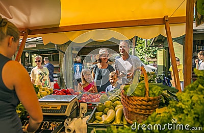 DOMZALE, SLOVENIA - Jul 15, 2019: Sunny Saturday morning at farmer's market Editorial Stock Photo