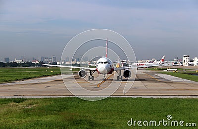 Airbus A320 neo of of Thai Airasia, Boeing 737-8AS, of Nokair, plane of Thai Lion Air and other airlines run in a row. Editorial Stock Photo