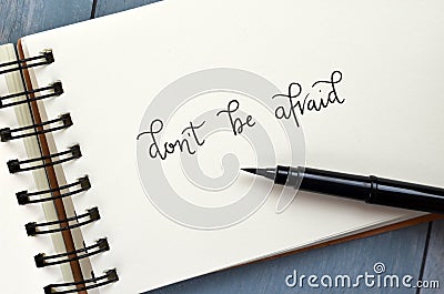 DON`T BE AFRAID hand-lettered in notepad Stock Photo