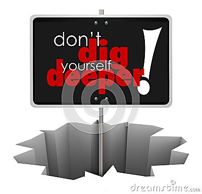 Don't Dig Yourself Deeper Sign Deeper SIgn in Hole Stock Photo