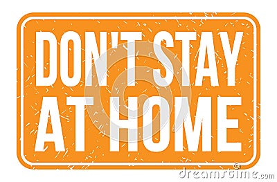 DON`T STAY AT HOME, words on orange rectangle stamp sign Stock Photo