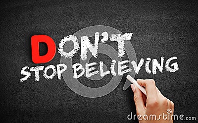 Don`t Stop Believing text on blackboard Stock Photo