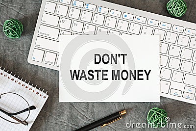Don`t waste money is written in a document on the office desk Stock Photo