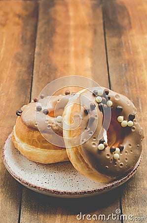 Donat. Donat in a white bowl on a wooden background. Closup Stock Photo