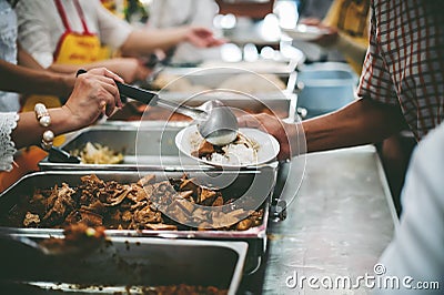 Donate food to the poor : concept Sharing Food With Homeless Stock Photo