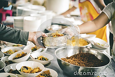 Donate food to the poor : Poverty concept Stock Photo