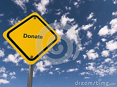 donate traffic sign on blue sky Stock Photo