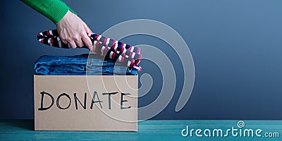 Donation Concept. Woman Preparing her Used Old Clothes into a Do Stock Photo