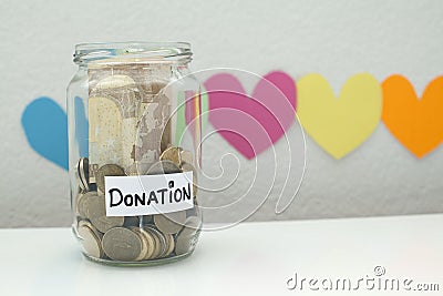 Donation donate money jar charity and relief concept Stock Photo