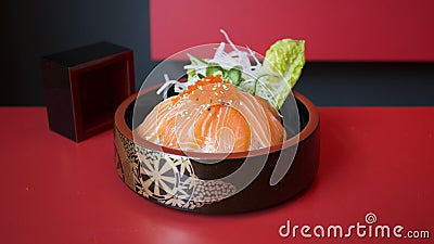 Donburi Salmon served in a Japanese restaurant in Tokyo . Japanese combo dish with chicken, rice, egg, and vegetables. Stock Photo