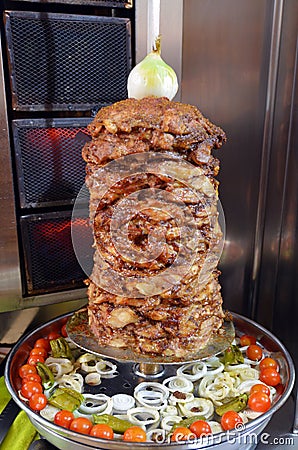 Doner kebab roasted on rotating spit Stock Photo