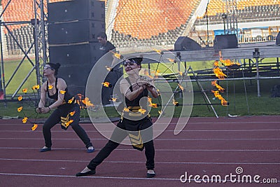 Donetsk, Ukraine - April 29, 2017: Show group performs with a torchlight procession Editorial Stock Photo