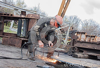 Donetsk, Ukraine - November, 06, 2012: Man working cutting torch Editorial Stock Photo