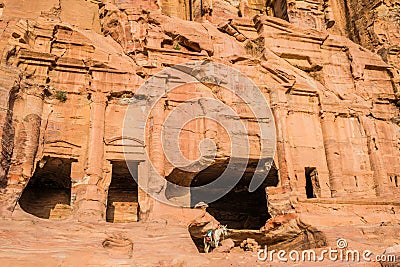 Donkey and royal tombs in nabatean city of petra jordan Stock Photo