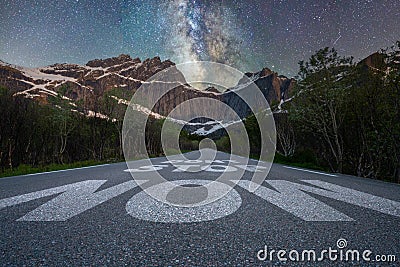Dont stop now text quote printed on asphalt road towards the mountains and the milky way Stock Photo