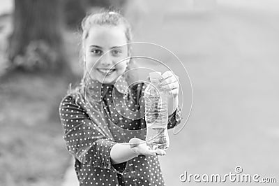 Dont wait, hydrate. Bottle of potable water selective focus. Little girl drinking water to quench thirst. Thirsty child Stock Photo