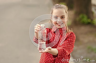 Dont wait, hydrate. Bottle of potable water selective focus. Little girl drinking water to quench thirst. Thirsty child Stock Photo