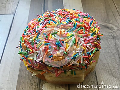 Donut with colorful, vivid frosting powder Stock Photo