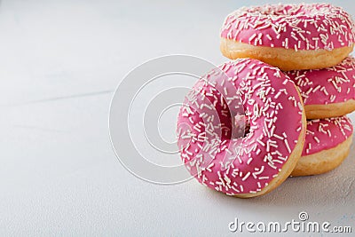 Donut. Sweet icing sugar food. Dessert colorful snack.Treat from delicious pastry breakfast. Bakery cake. Doughnut with frosting. Stock Photo