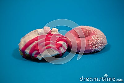 Donut. Sweet sugar with powdered sugar. Dessert of colorful snacks. Treat yourself to a delicious Breakfast with delicious pastrie Stock Photo