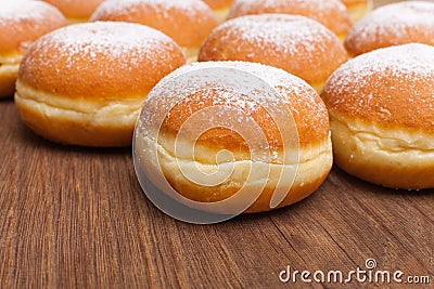 Many donuts on wooden board Stock Photo