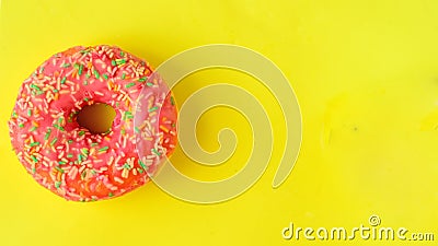 Donuts on pastel yellow background. Stock Photo