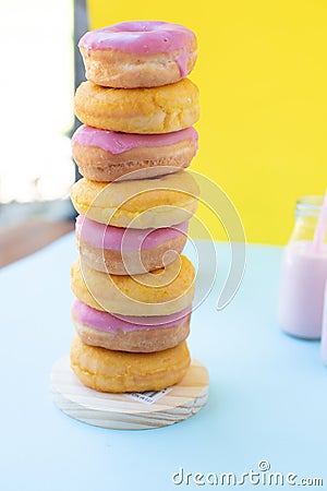 Donuts stacked with strawberry milk Stock Photo