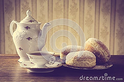 Donuts on tray with cup of coffee in old-fashioned Stock Photo