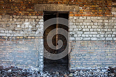 Door aperture inside the old ruined brick building Stock Photo