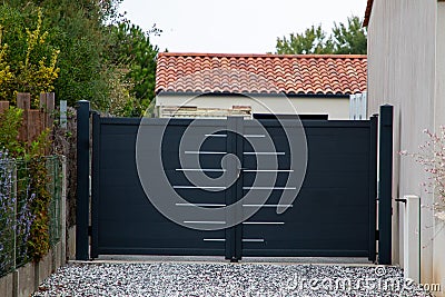 Door black access aluminum gray gate and double portal grey of suburb house Stock Photo